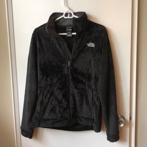 Black fuzzy women’s north face jacket
